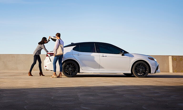 2023 Toyota Camry exterior couple loading trunk